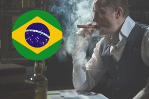 un uomo fuma il sigaro e una bandiera del brasile